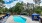 Wide-lens shot of the pool, cabana's, chaise lounges at 700 Riverchase Apartments near Birmingham, AL
