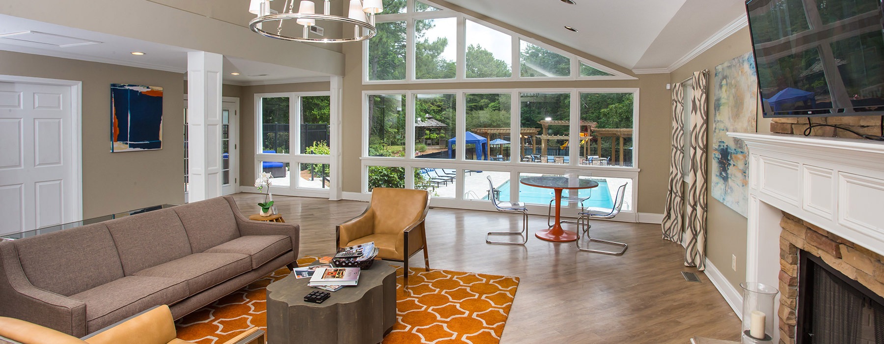 Resident lounge area by pool at 700 Riverchase Apartments in Hoover, AL